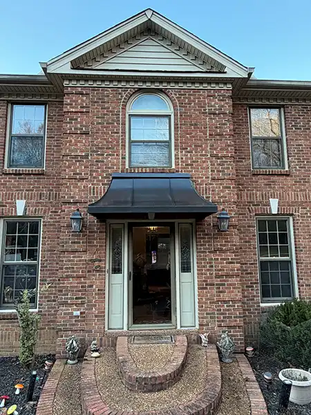 Juliet awning on residential brick home